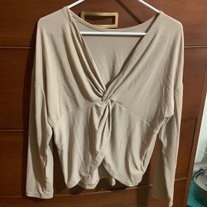 Beige open back long sleeve shirt